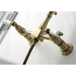KS124XPLBS-P Heritage Two-Handle Wall Mount Bridge Kitchen Faucet with Brass Sprayer Wall Mounted Kitchen Faucets